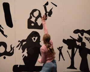 Participant engaging with the materials (magnets) as part of Sofie’s Room